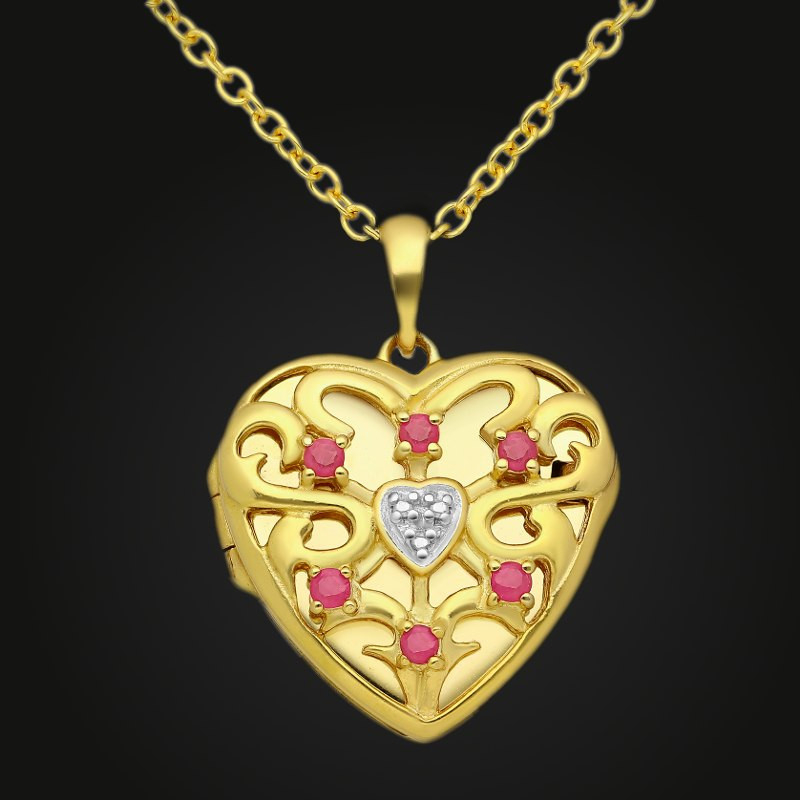 "Corazón de dragón"-colgante portafoto en plata con oro piedras esmeraldas, zafiros, rubíes "Corazón de dragón"-colgante portafoto en plata con oro piedras esmeraldas, zafiros, rubíes